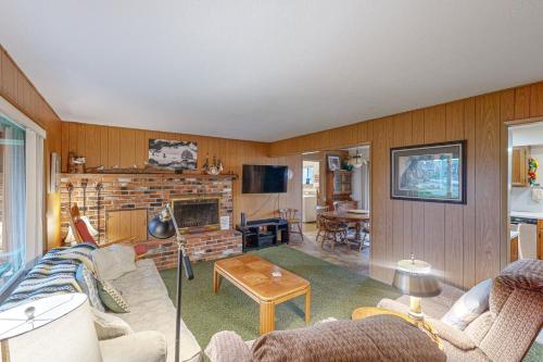 a living room with a couch and a fireplace at Tolovana Treasure in Cannon Beach