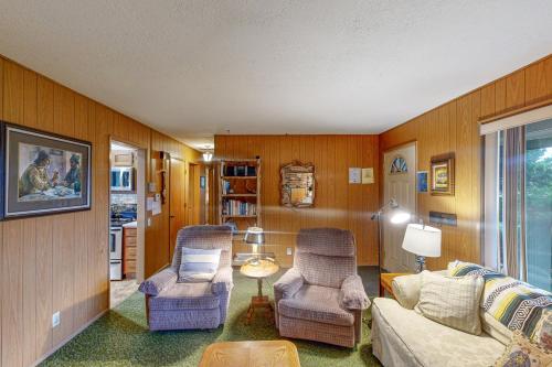 a living room with two chairs and a couch at Tolovana Treasure in Cannon Beach