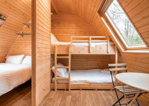a room with two bunk beds in a cabin at Lakeside Pods - pets welcome in Oldham