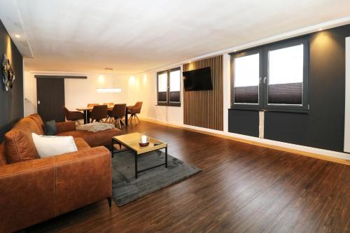a living room with a couch and a table at Ferienwohnung 5 in Zemitz