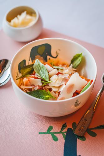 a bowl of food sitting on top of a table at Esplanade Zagreb Hotel in Zagreb