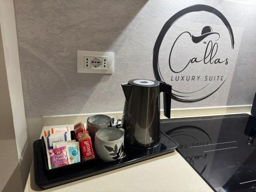 a coffee maker on a tray on a kitchen counter at Callas Luxury Suite Verona in Verona