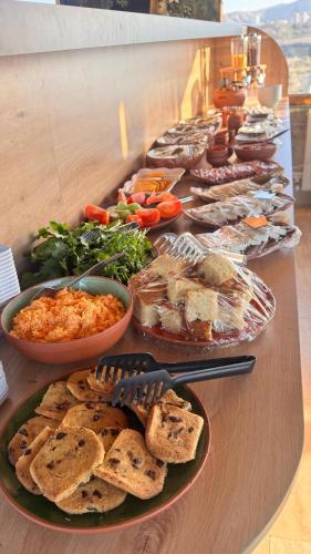 a buffet of food on a table with plates of food at My Cave Suites in Nevsehir