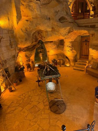 a room with a fireplace in a cave at My Cave Suites in Nevsehir