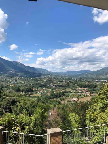 a view of a city with mountains in the distance at Casa Vacanze Il Vicolo - Oliveto Citra in Oliveto Citra