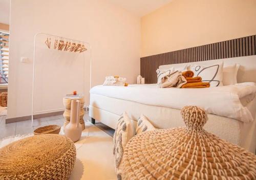 a bedroom with a large bed with a large ottoman at Calya Family Home in Brussels - 4 Bedrooms in Sint-Pieters-Leeuw