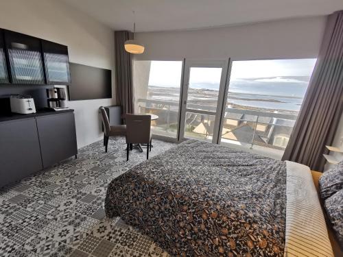 Postel nebo postele na pokoji v ubytování Studio vue mer roscoff et île de batz
