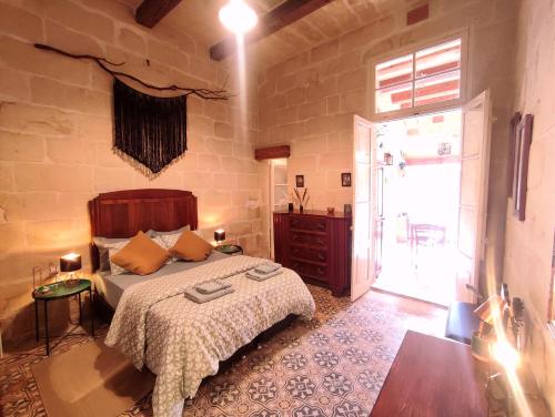 Postel nebo postele na pokoji v ubytování OnTheRocks - Holiday Home in Victoria, Gozo