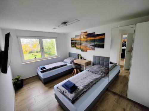 Ένα ή περισσότερα κρεβάτια σε δωμάτιο στο Schaefer Apartments - Haus Rote Warte
