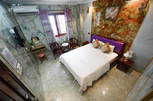 Ένα ή περισσότερα κρεβάτια σε δωμάτιο στο Ly Ly Hotel