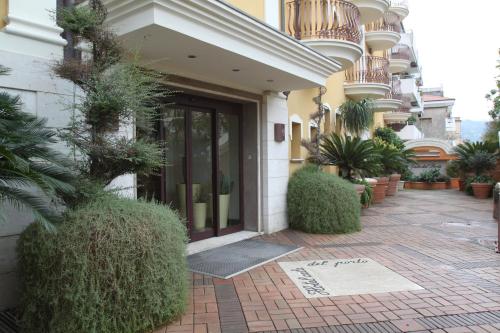 a front door of a building with plants on it at Hotel Cala Del Porto in Vibo Valentia Marina