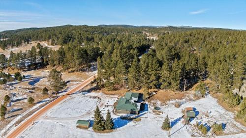 an aerial view of a house in the middle of a forest at Custer Gem in Custer