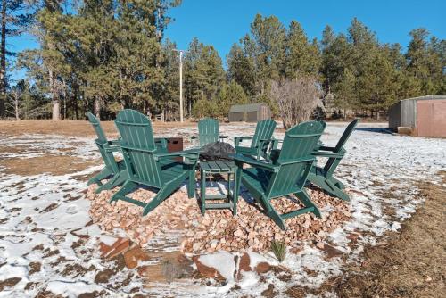 four green chairs and a table in the snow at Custer Gem in Custer