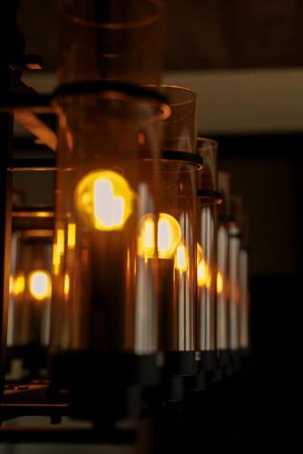 a row of candles are lined up in a row at VAUX Park Street Hotel - A collection of 8 luxury lofts in Colombo
