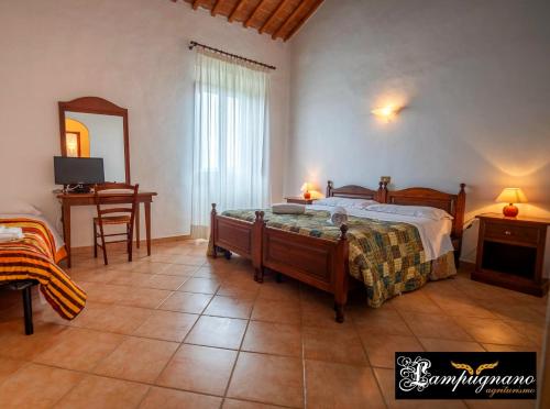 Postel nebo postele na pokoji v ubytování Agriturismo Lampugnano