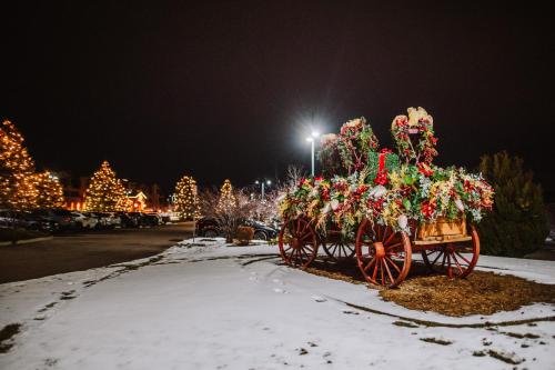 a christmas decoration of a horse drawn carriage in a parking lot at Flying Horse Resort & Club in Colorado Springs