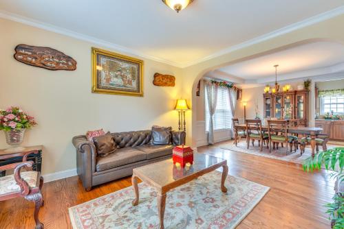 a living room with a couch and a table at 3 Mi to Carowinds Retreat with On-Site Fishing in Fort Mill
