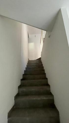 a staircase in a white building with a stair case at Casa Laguna Escape in Mestre