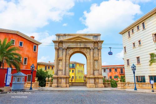 an arch in a city with colorful buildings at Luna Sol Villas - Dedicated Care Until Check Out in Phu Quoc