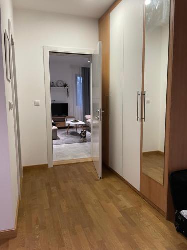 a room with an open door and a living room at Villa Evergreen in Kopaonik