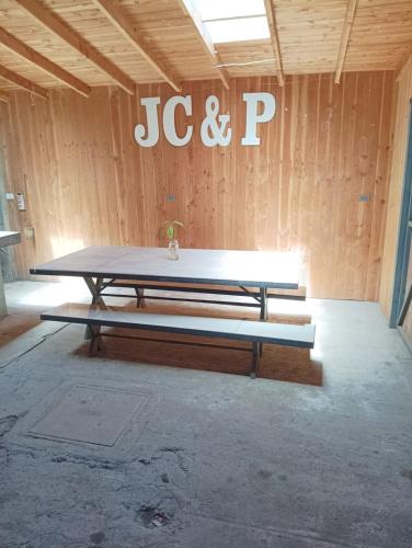 a ping pong table sitting inside of a room at Casa Tinaja Quincho in Licán Ray
