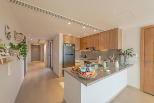 a kitchen with a counter with a basket of food on it at Stylish 3 BR Retreat at Ancient Hills El Gouna in El Gouna