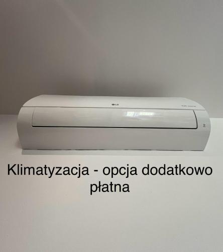 a white dvd player sitting on top of a wall at Za Gościńcem in Kazimierz Dolny