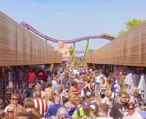 a large crowd of people walking through an amusement park at Serenity - Luxury Hot Tub, Sunnymede, Fantasy Island, , Ramped Access, Parking, Dog Friendly in Ingoldmells