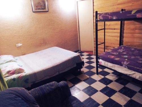 En eller flere senge i et værelse på TCH Capsule Home