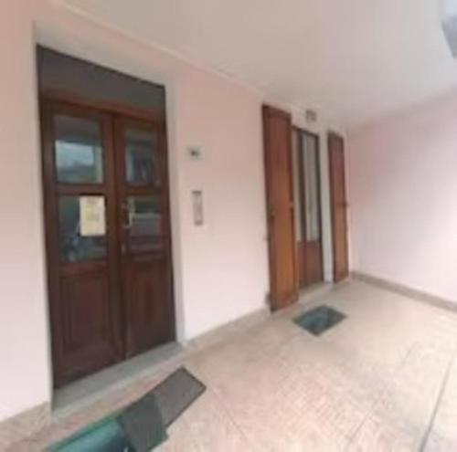 an empty room with doors and a tiled floor at Alloggio Ursula in Lagaro
