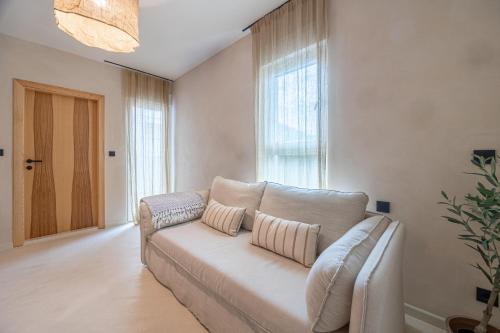 a living room with a couch and a window at lo͝or luxury retreat in Split