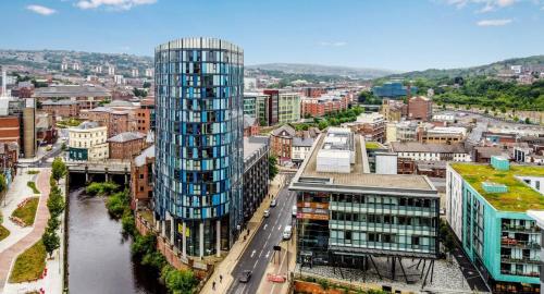 an aerial view of a city with a tall building at Penthouse Gem, Central, Scenic Views, Stylish, Modern, City Centre 2BR in Sheffield