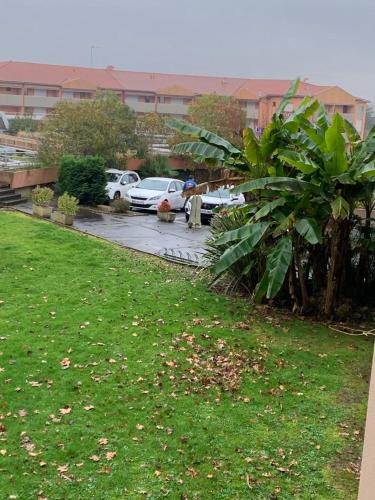 a group of cars parked in a parking lot at Très jolie studio à louer avec sa belle terrasse de 4m2 idéalement situé dans un hôtel thermale in Dax