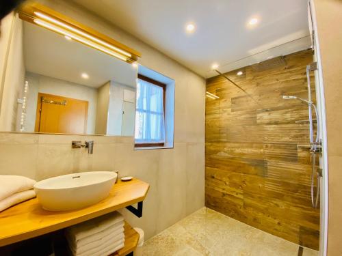 a bathroom with a sink and a shower at Haus Plattenkar in Obertauern