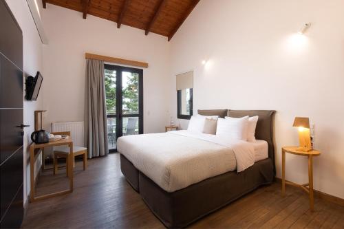 Postel nebo postele na pokoji v ubytování Natura Hotel Vytina