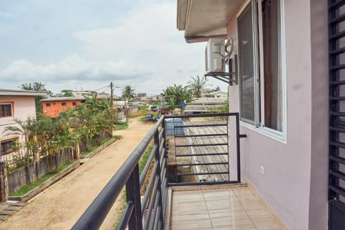 a balcony with a view of a street at Cosy Refuge in Bonabéri