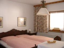Кровать или кровати в номере Ferienwohnung Familie Höfler