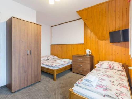 Postel nebo postele na pokoji v ubytování Wypoczynek u komperdow Jacuzzi&Basen ogrodowy
