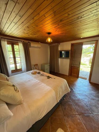 Postel nebo postele na pokoji v ubytování Hostal Campo Divino