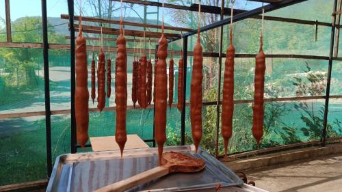 a bunch of sausages hanging from a rack at Excellent Hostel Kutaisi in Kutaisi