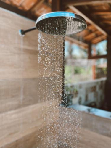 a stream of water coming out of a shower at Casa Ipoméia Azul in Itacaré