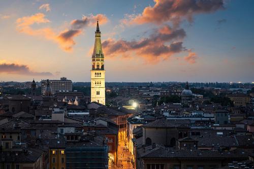 a view of a city with a clock tower at A casa mia in Modena