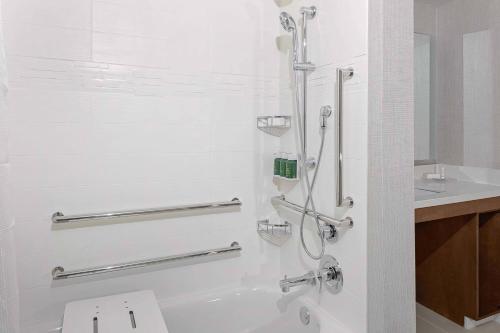 a bathroom with a shower with a toilet and a sink at Residence Inn by Marriott Tuscaloosa in Tuscaloosa