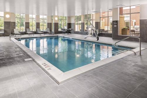 a large swimming pool in a hotel building at Residence Inn by Marriott Tuscaloosa in Tuscaloosa