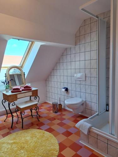 a bathroom with a shower and a toilet and a sink at Landgut Hoppstall in Winterfeld