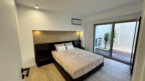 Ένα ή περισσότερα κρεβάτια σε δωμάτιο στο Apartment at the Beach