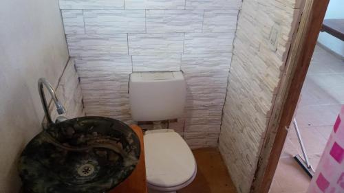 a small bathroom with a toilet and a sink at Departamentos Lovaiza`s in Barrio Félix U Camet