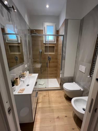 a bathroom with a shower and a sink and a toilet at Roma Cento new apartment in Rome