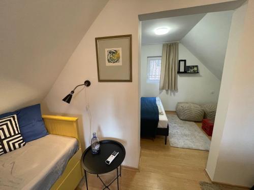 a small room with a bed and a small bedroom at Stellar Mátra in Mátraszentimre