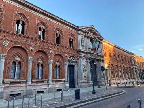 a large brick building with a street in front of it at Duomo intero appartamento in Milan